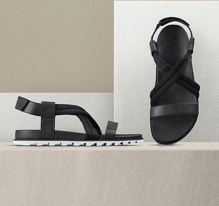 A pair of Roaming Decon sandals on a beige background