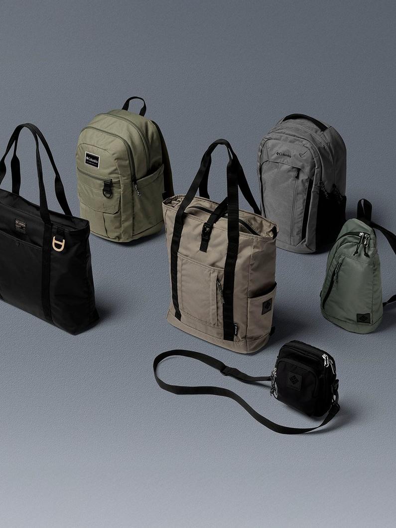 Collection of six bags in various styles including backpacks, tote bags, and a crossbody bag in neutral tones.