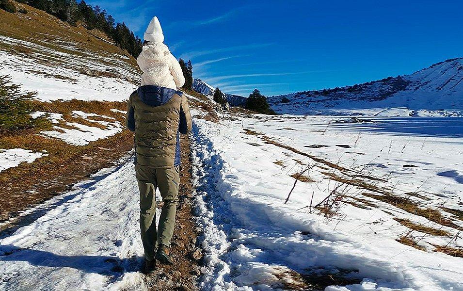 Hiking with a child on the shoulders