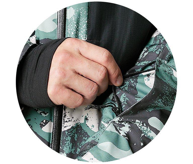 Someone sliding a card out of a sleek jacket pocket.