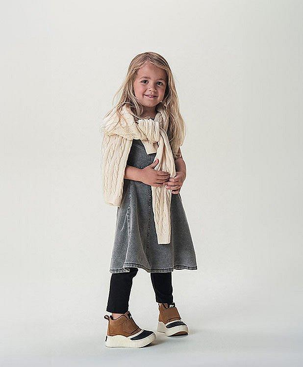 Little girl wearing Sorel shoes
