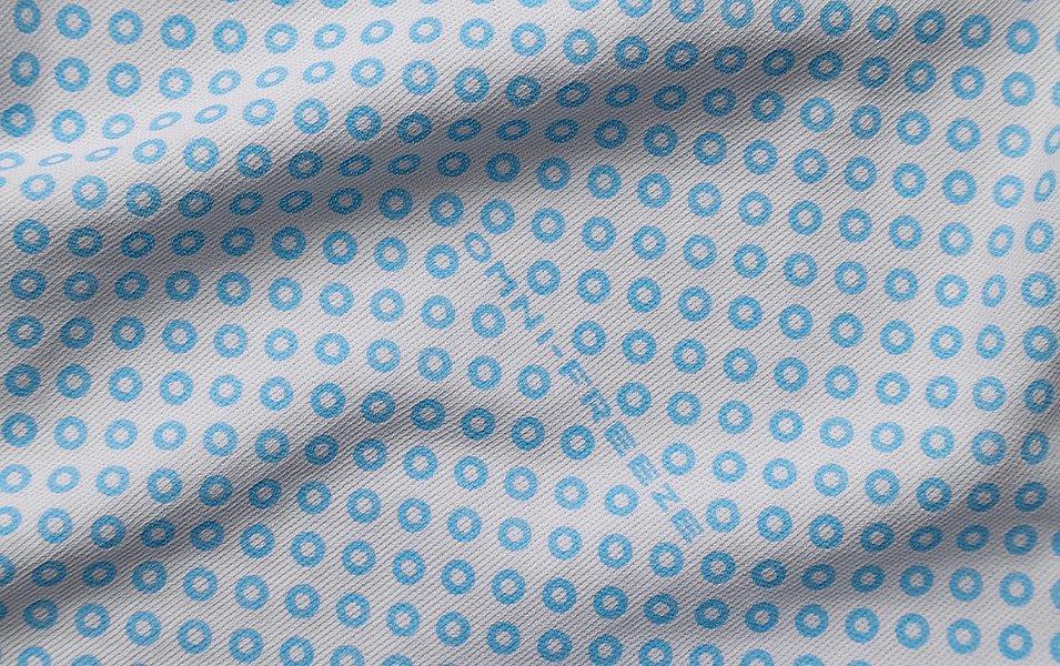  A close-up of Columbia’s Omni-Freeze Zero highlights its small blue circles, showcasing the visible cooling technology.