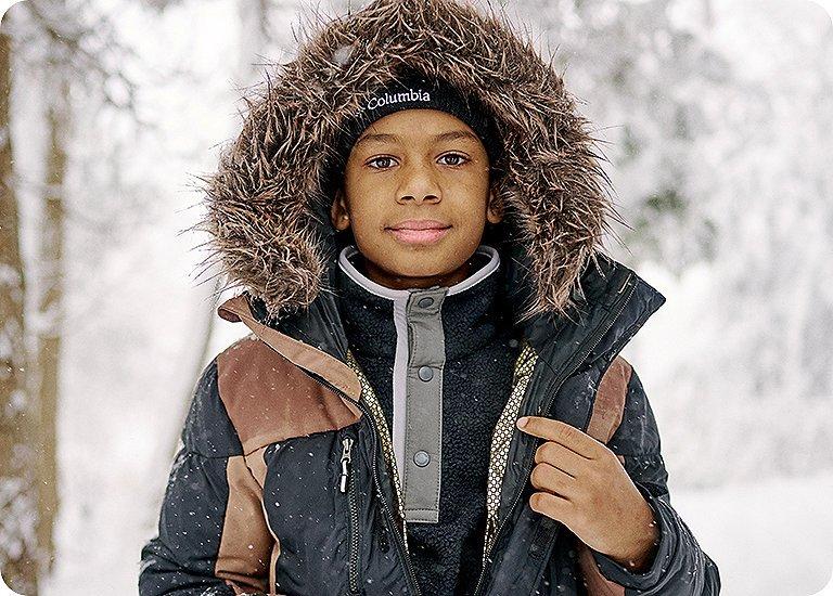A kid out exploring in bestselling Columbia gear.