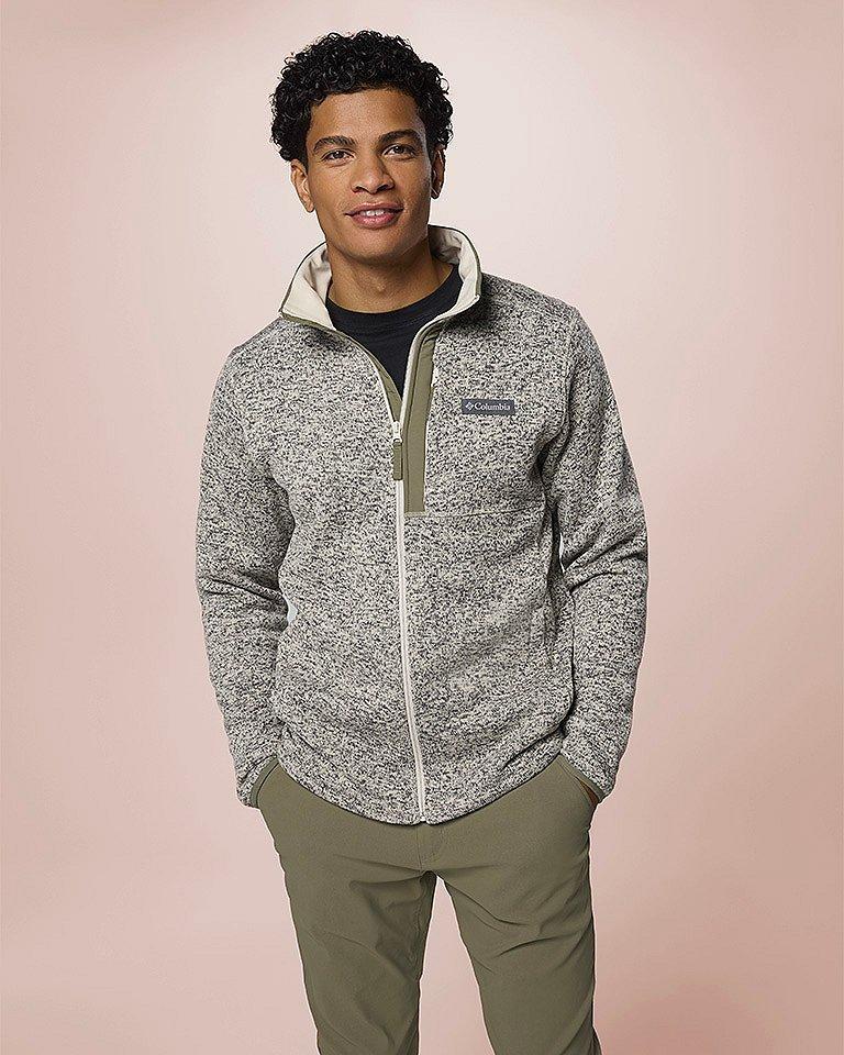 A man smiling wearing a soft, plush fleece.