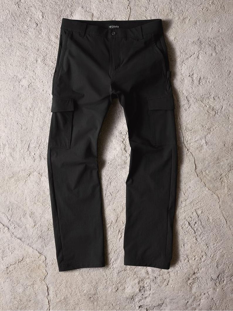 Black cargo pants with side pockets and button closure laid flat on textured surface.