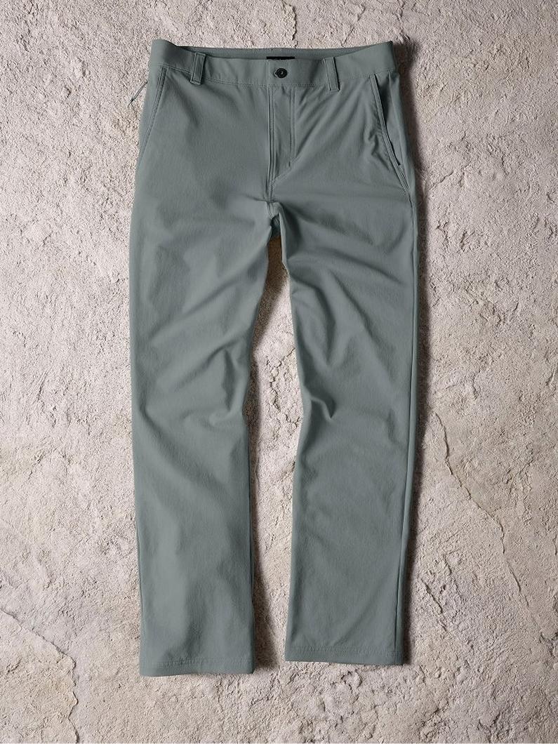 Sage green straight-leg pants with front pockets and button closure, laid flat on textured surface.