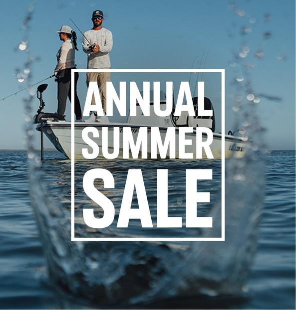 Two people fishing from a boat on open water with ANNUAL SUMMER SALE text overlay.