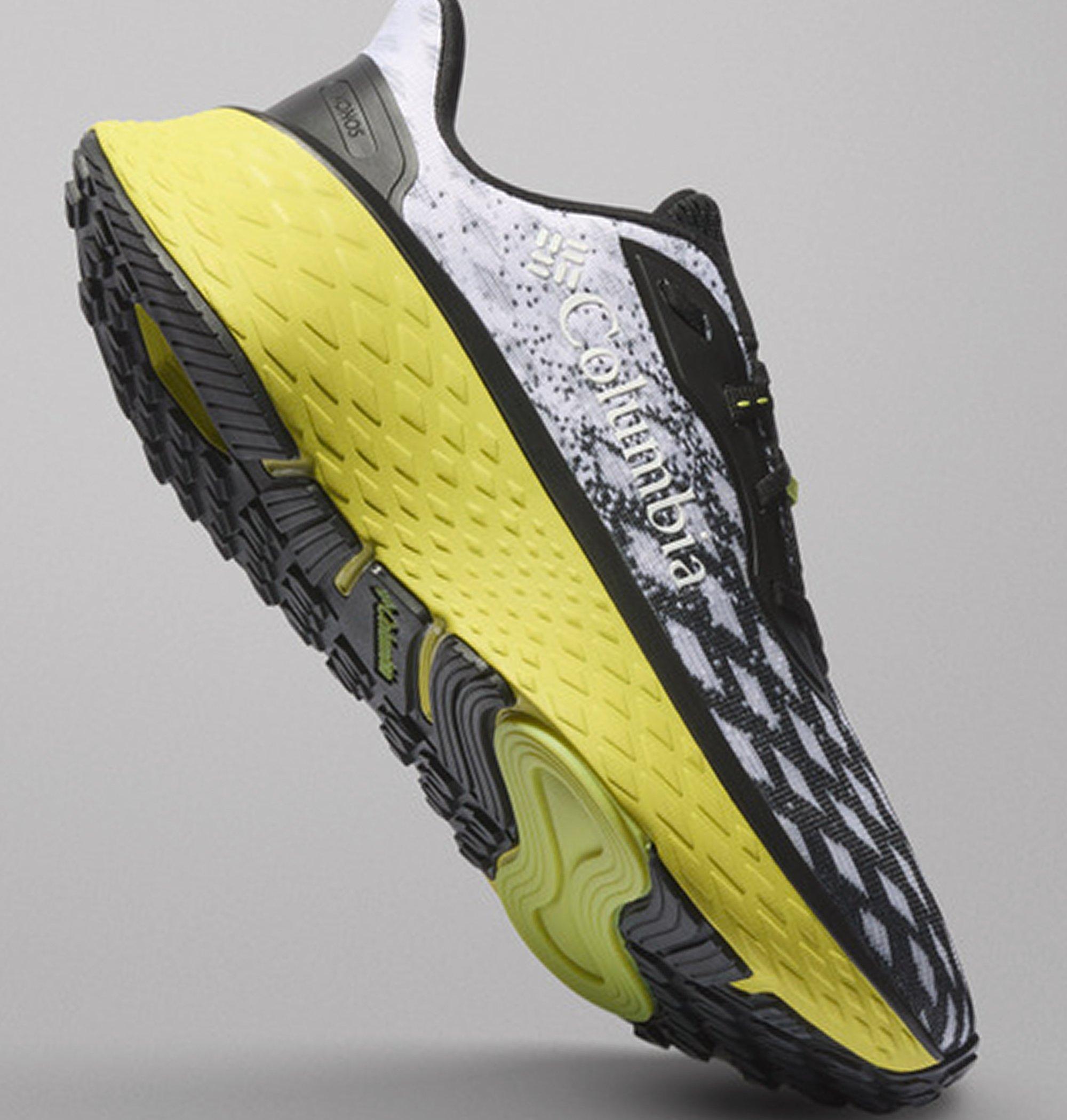 Sole of a shoe floating on a gray background.