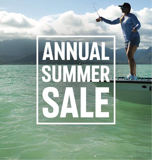 Person fishing from a boat on a lake with mountains in the distance and text reading ANNUAL SUMMER SALE.