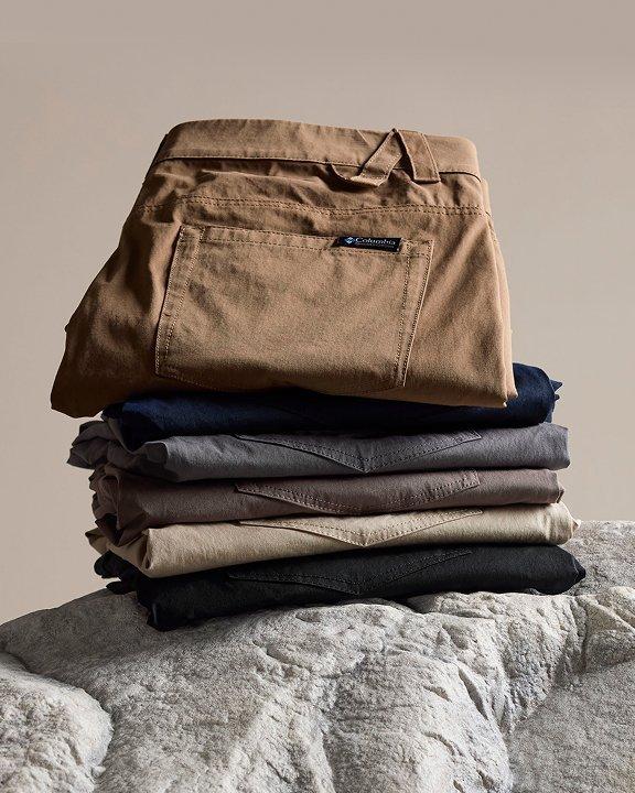 A stack of pants sitting on a rock.