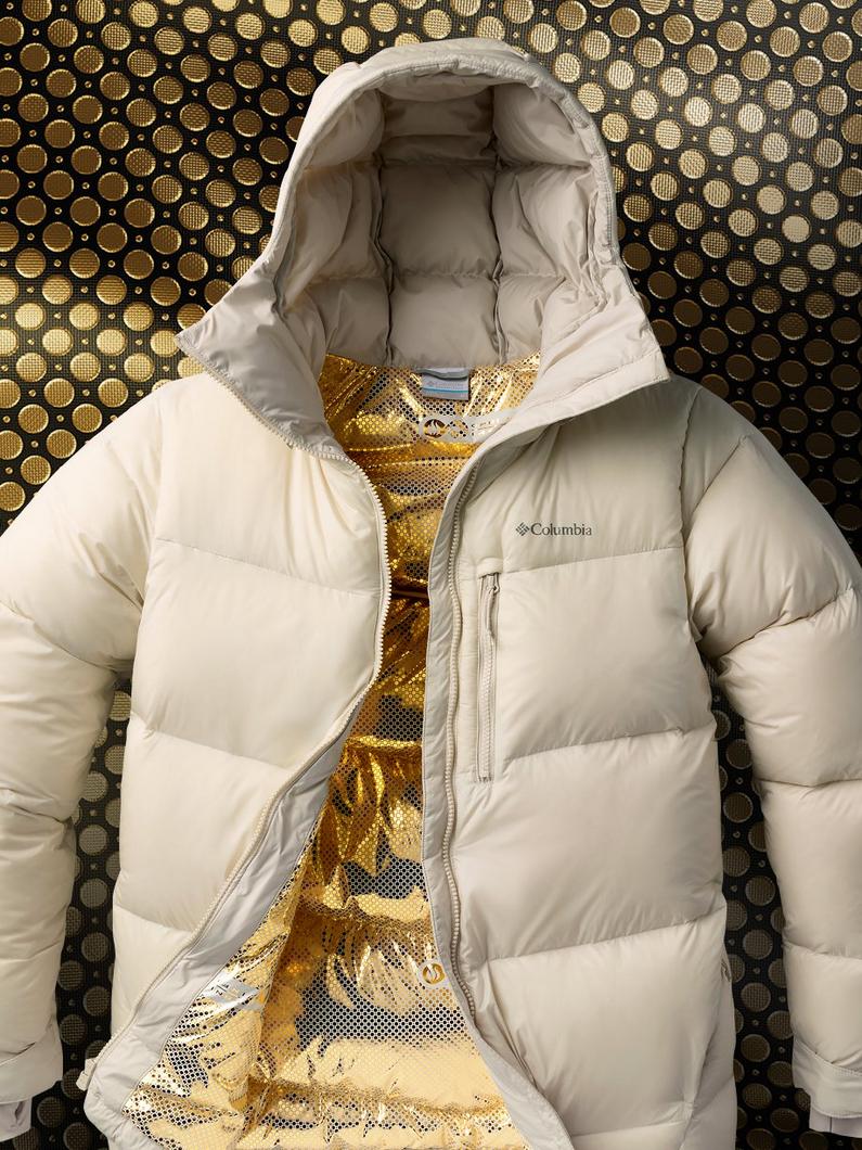 Cream-colored puffer jacket with hood, partially unzipped to reveal gold sequined lining inside.