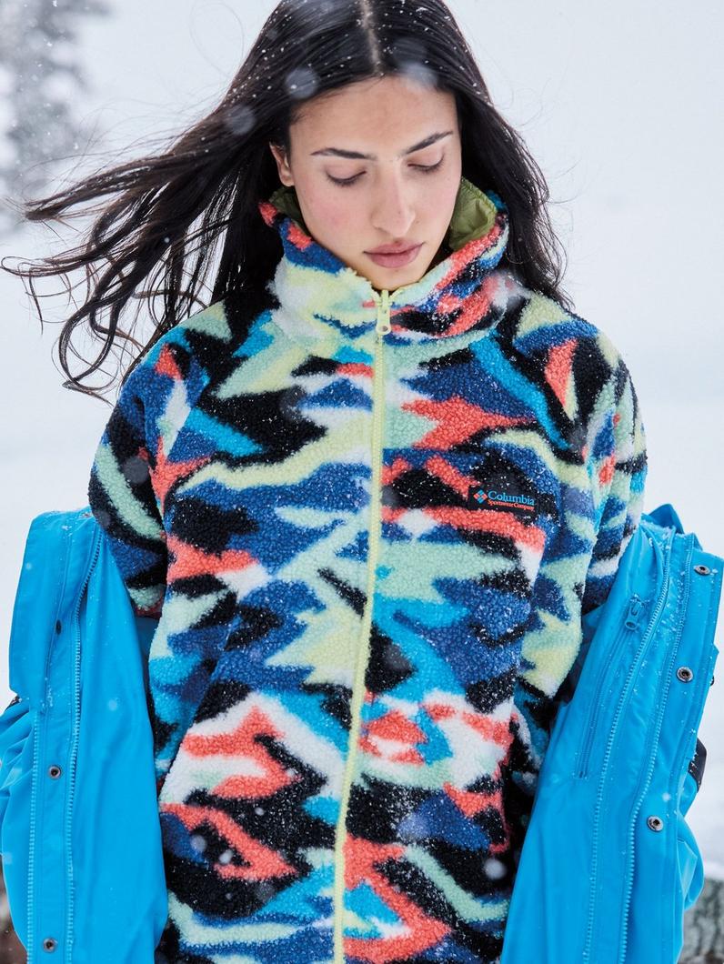 A woman wearing a colorful Interchange jacket.