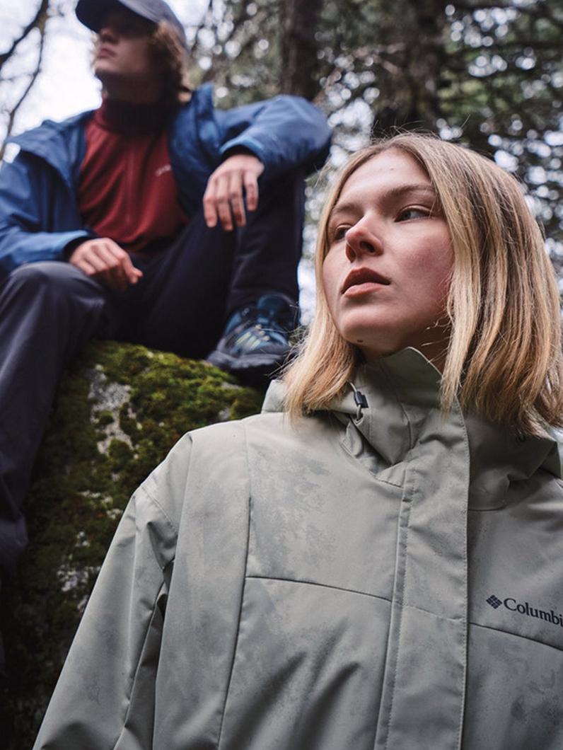 Two hikers wearing jackets.