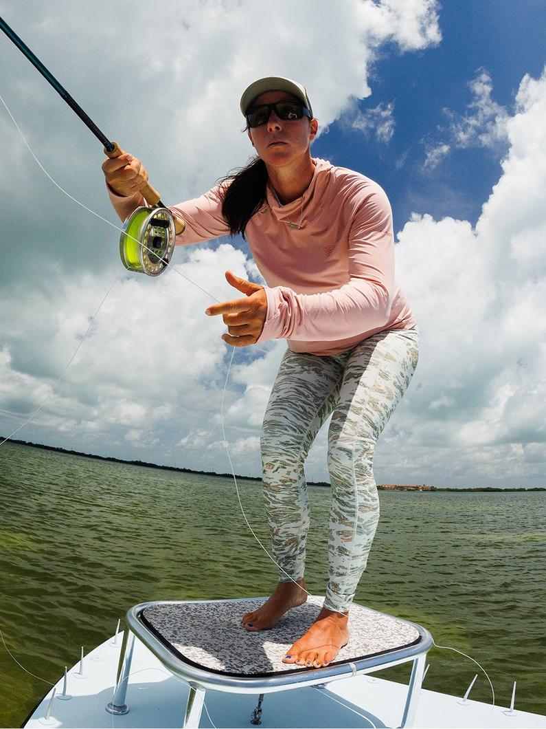 Pro angler Wesley Locke wearing PFG on a boat.