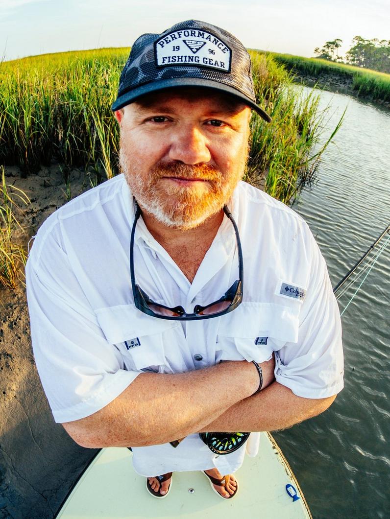 Artist Paul Puckett crossing his arms