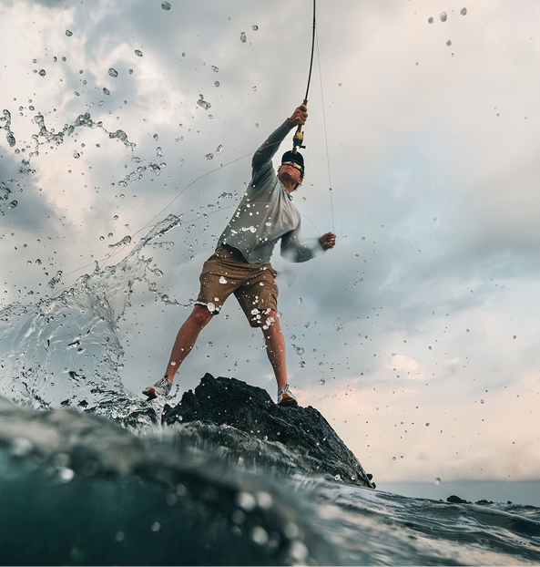 Angler casting his line in splashy, intense water.