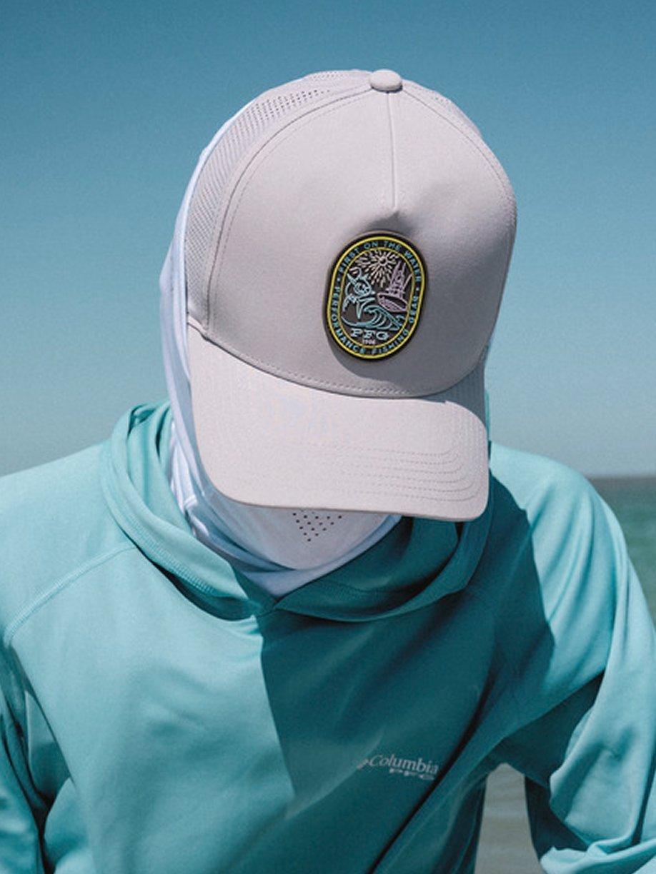 Fishing hat on a person looking down.