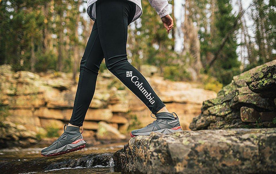 Person walking along river. 