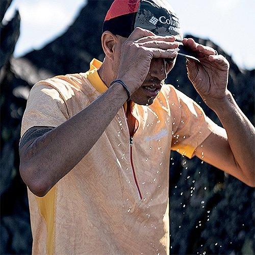 A man readjusting his cap
