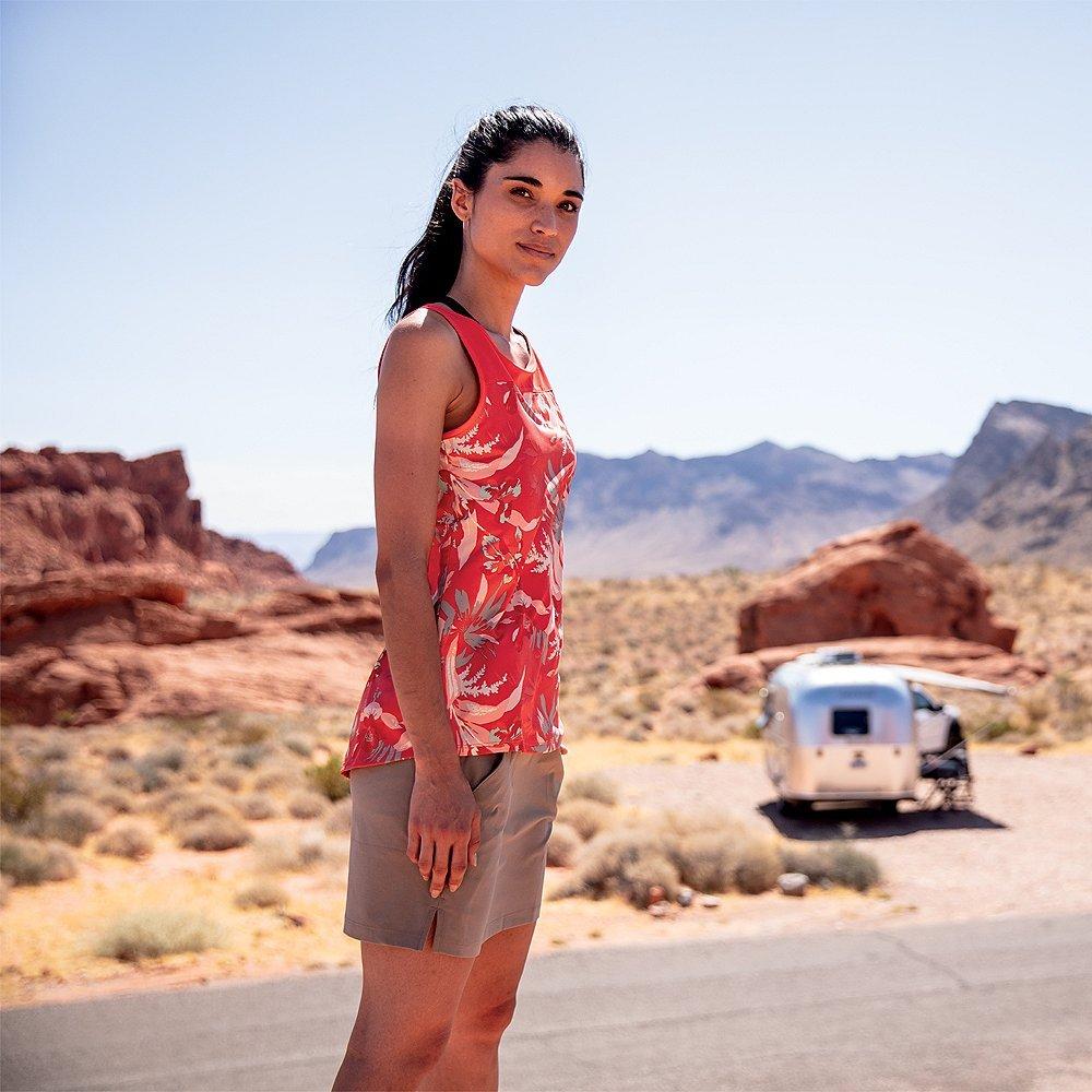 A woman standing In a deserted landscape
