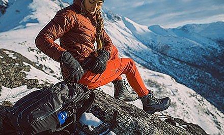 A mountain climber wearing boots with Omni-Heat. 