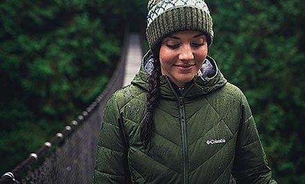 A woman wearing a jacket with Omni-Heat thermal reflective technology. 