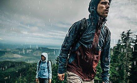 A man and woman hiking in Omni-Tech gear. 