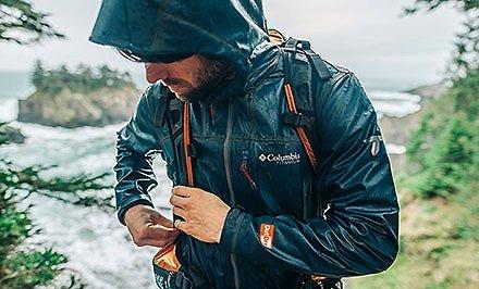 A man wearing an OutDry Extreme jacket. 