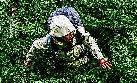 A woman wearing an OutDry Extreme Eco jacket. 