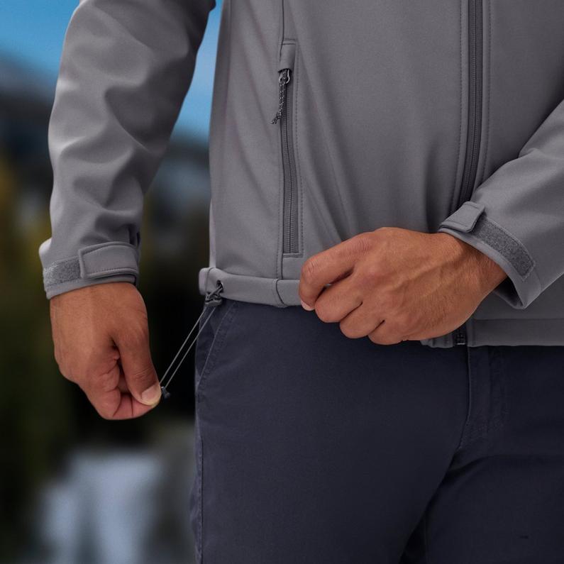 Close-up of a model pulling the drawcord on the adjustable hem.