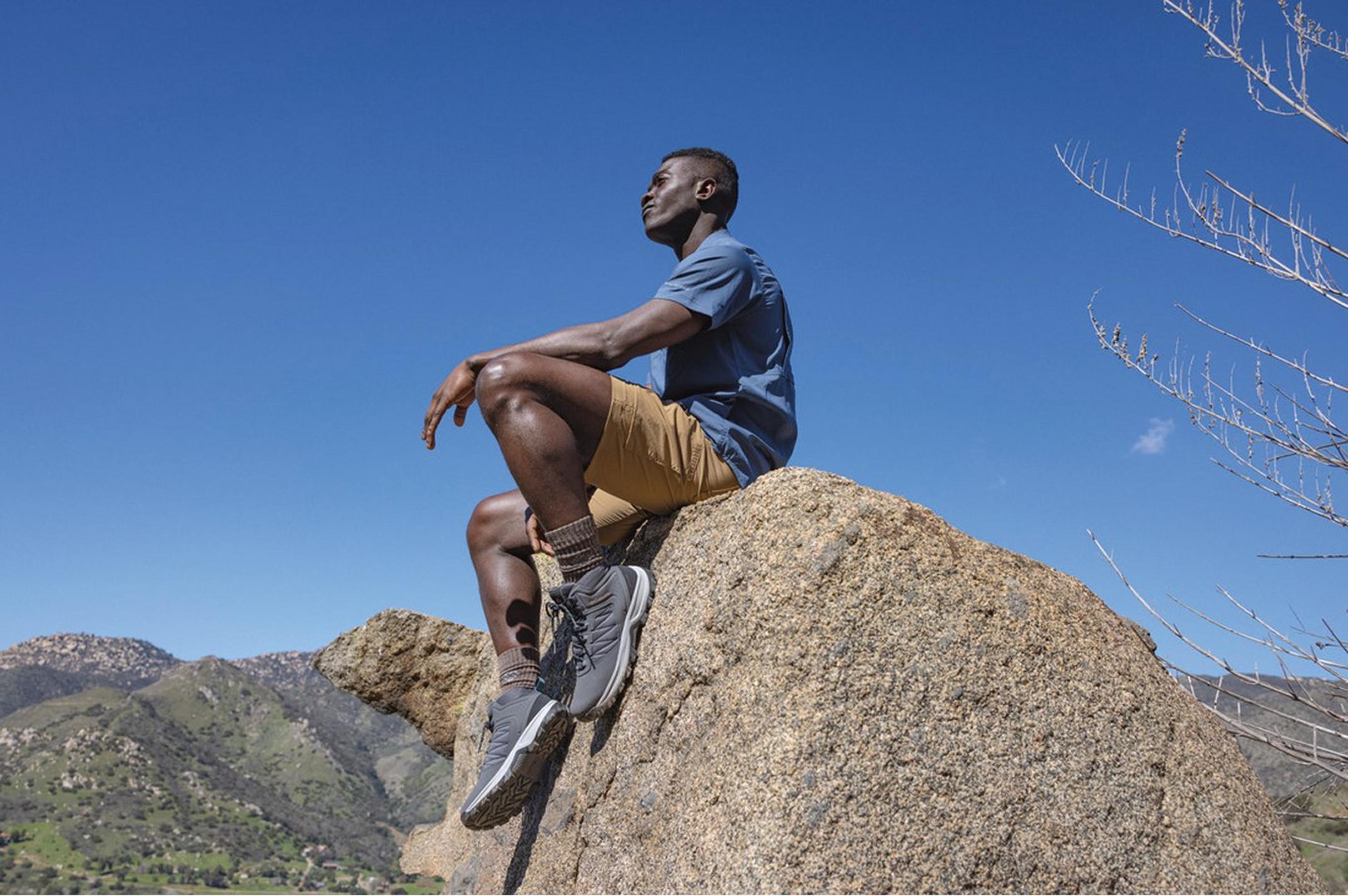 Man in Silver Ridge cargo shorts. Omni-Shade logo.