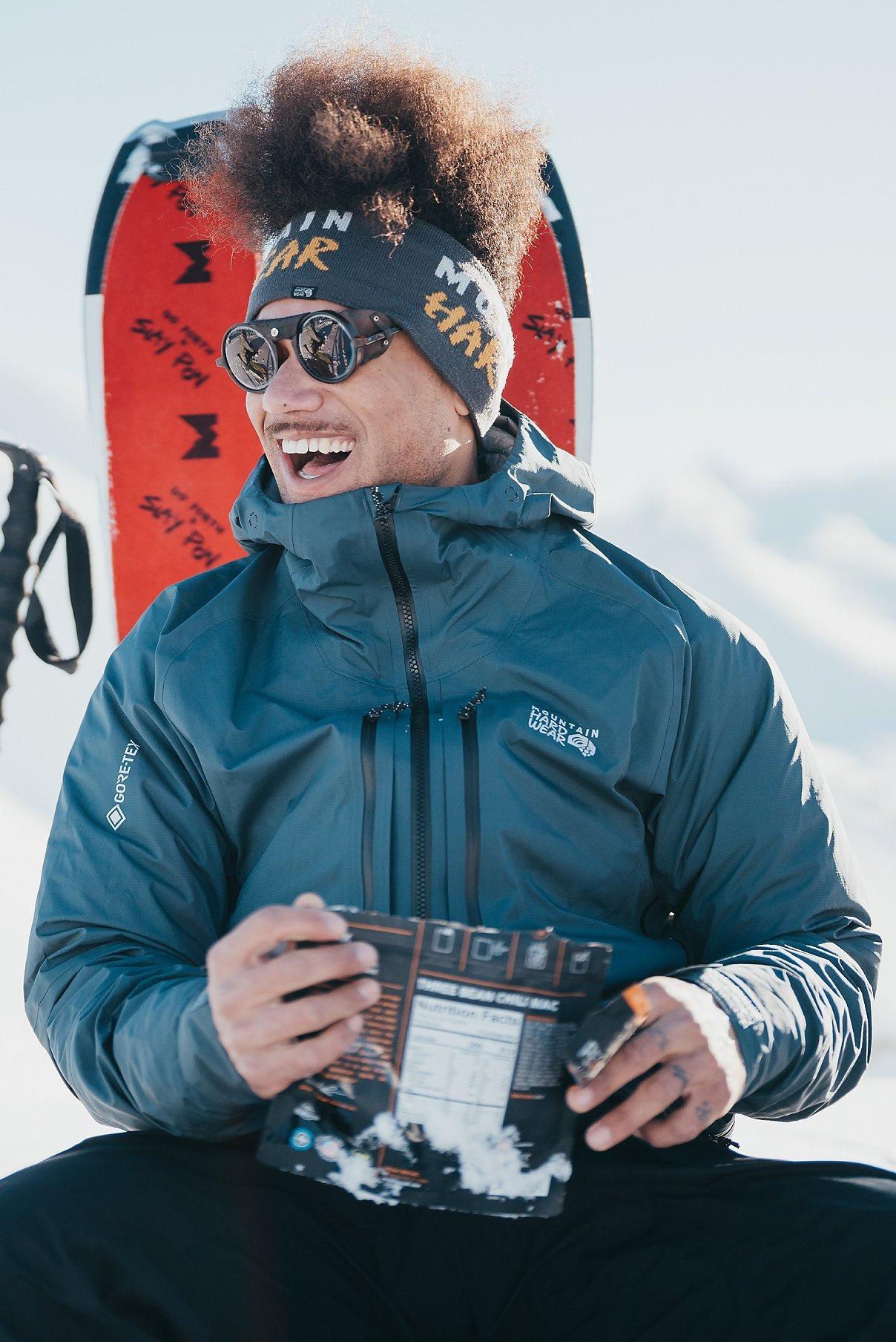 Bryce eating a hot meal in the snow