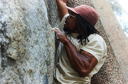 Close-up of Caleb gripping a hold