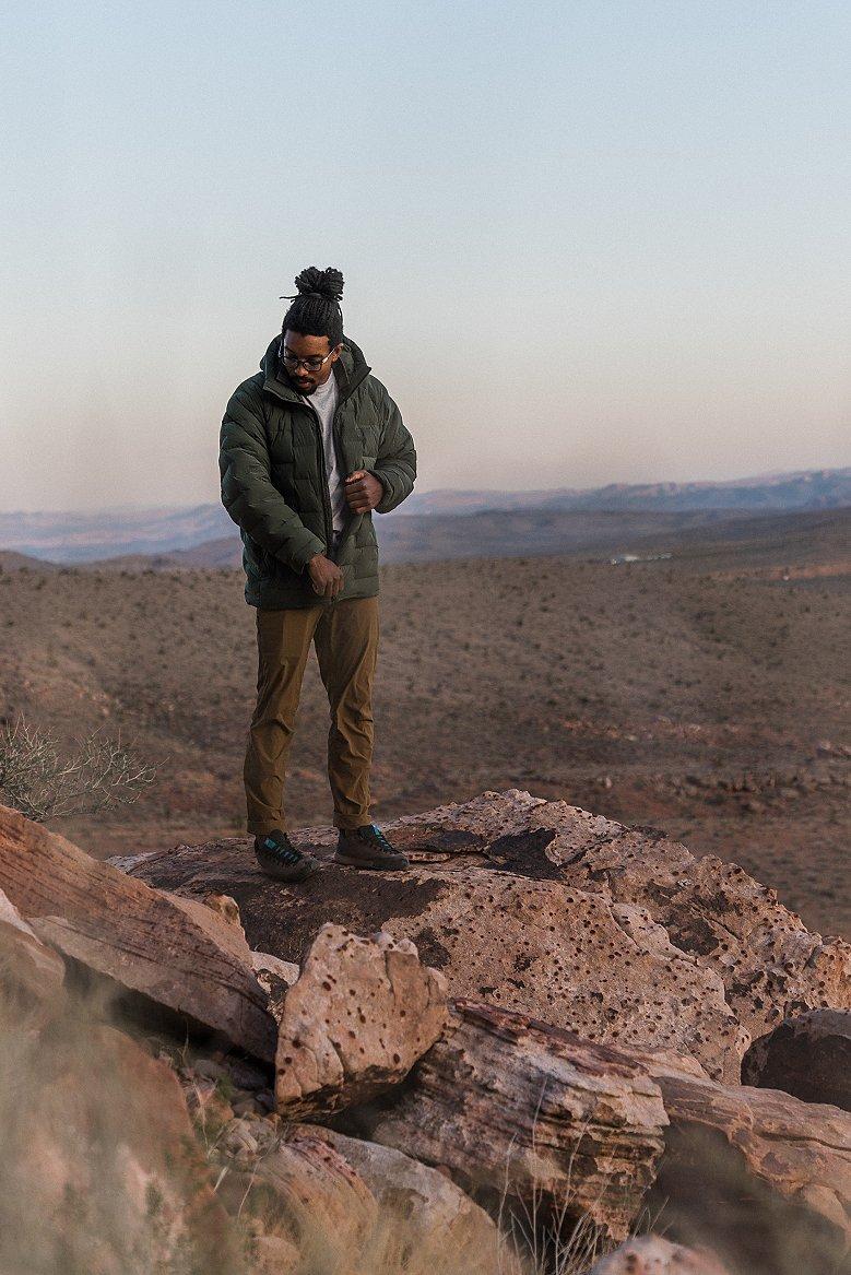 Caleb standing on rocks