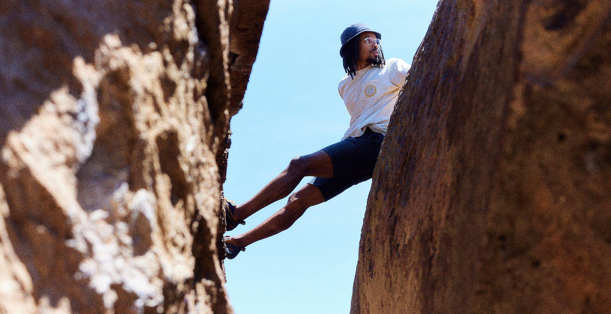 Caleb sitting on rocks