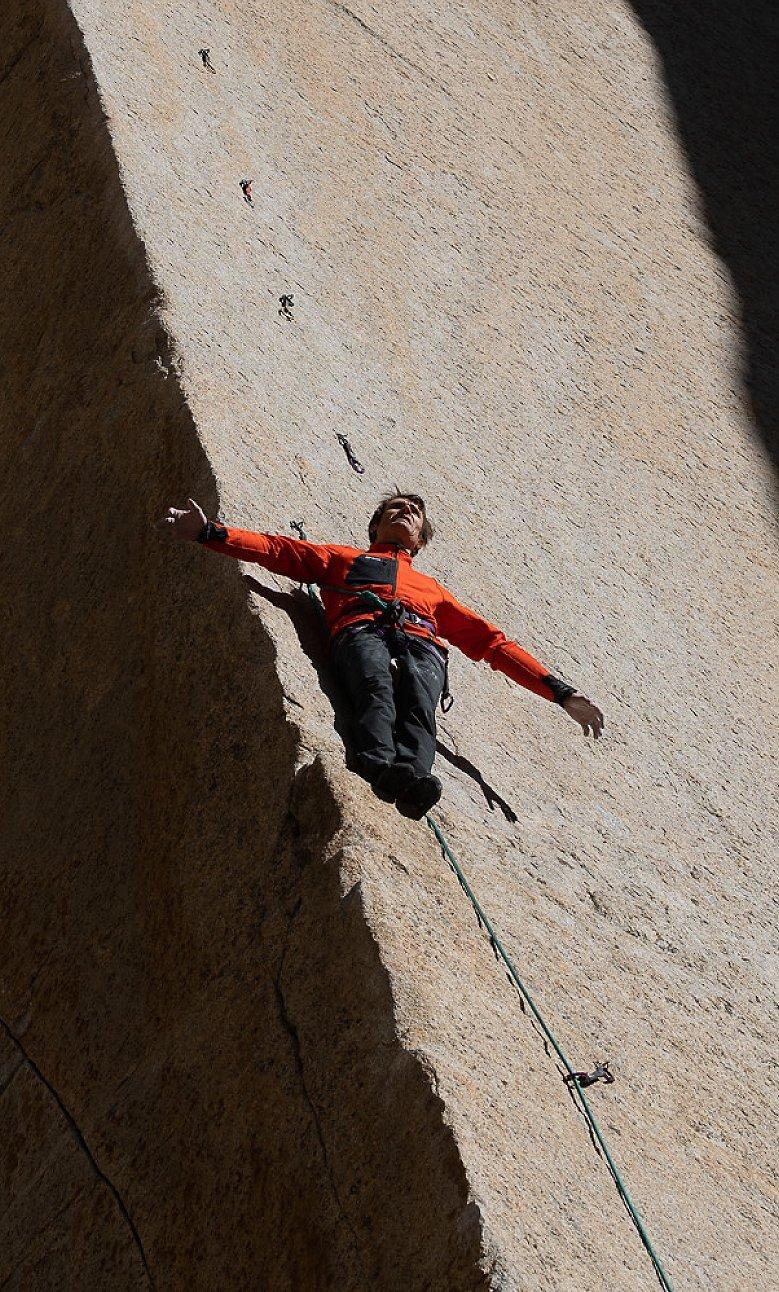Ethan leaning against a wall while climbing