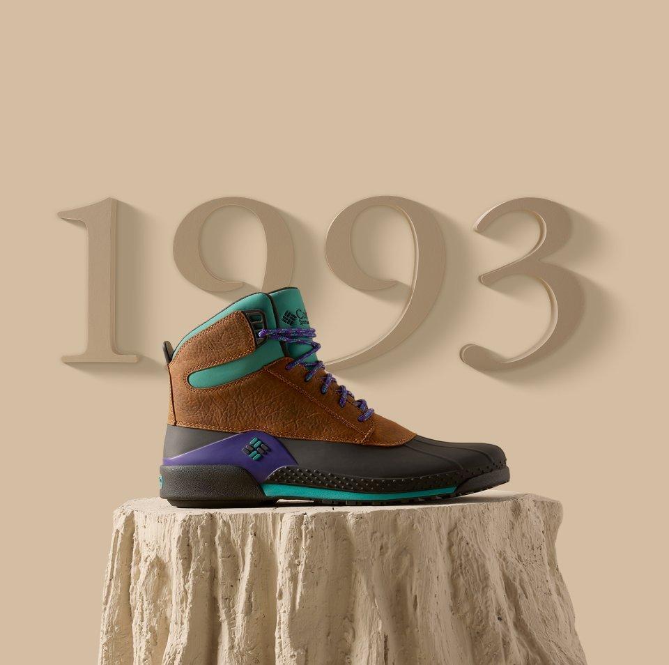 Boot posed on a stylized log display.