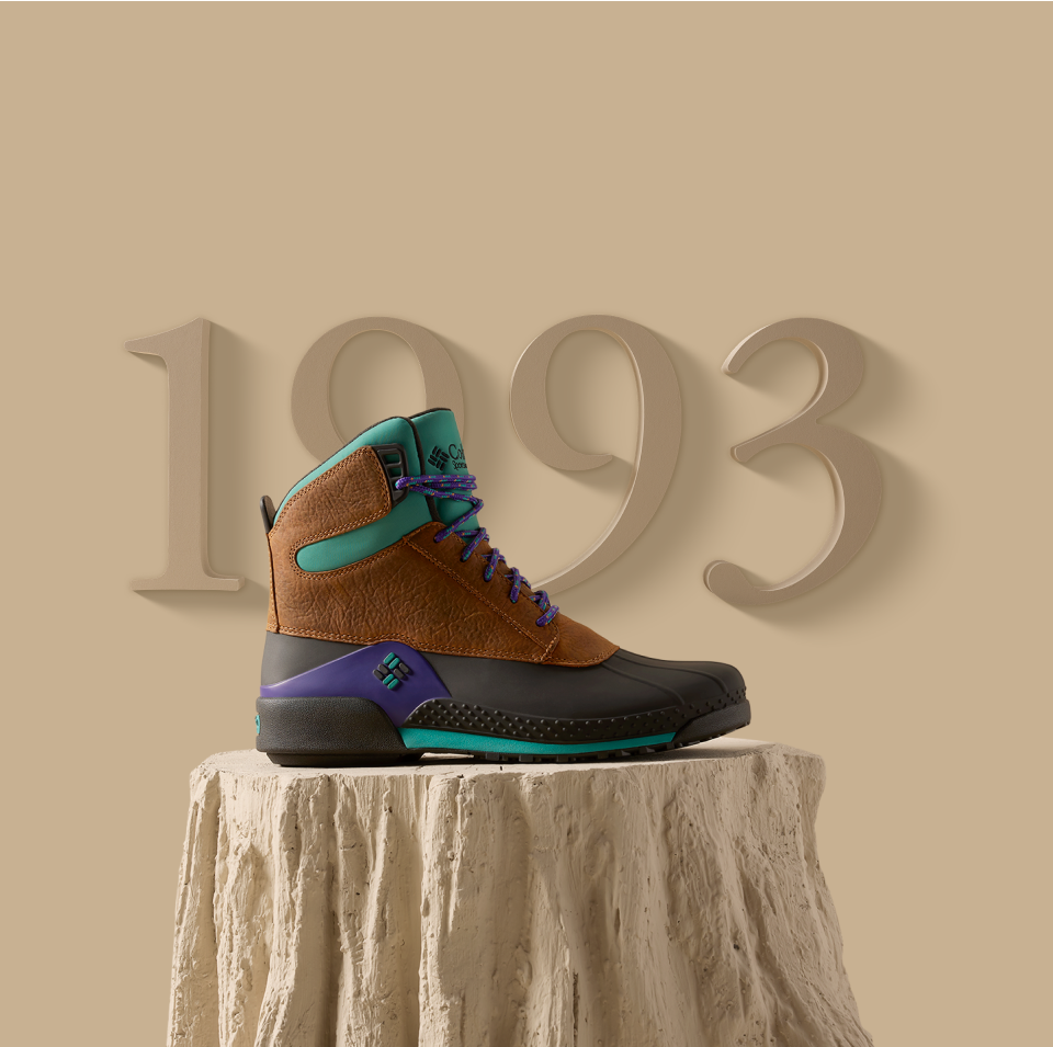 Boot posed on a stylized log display.