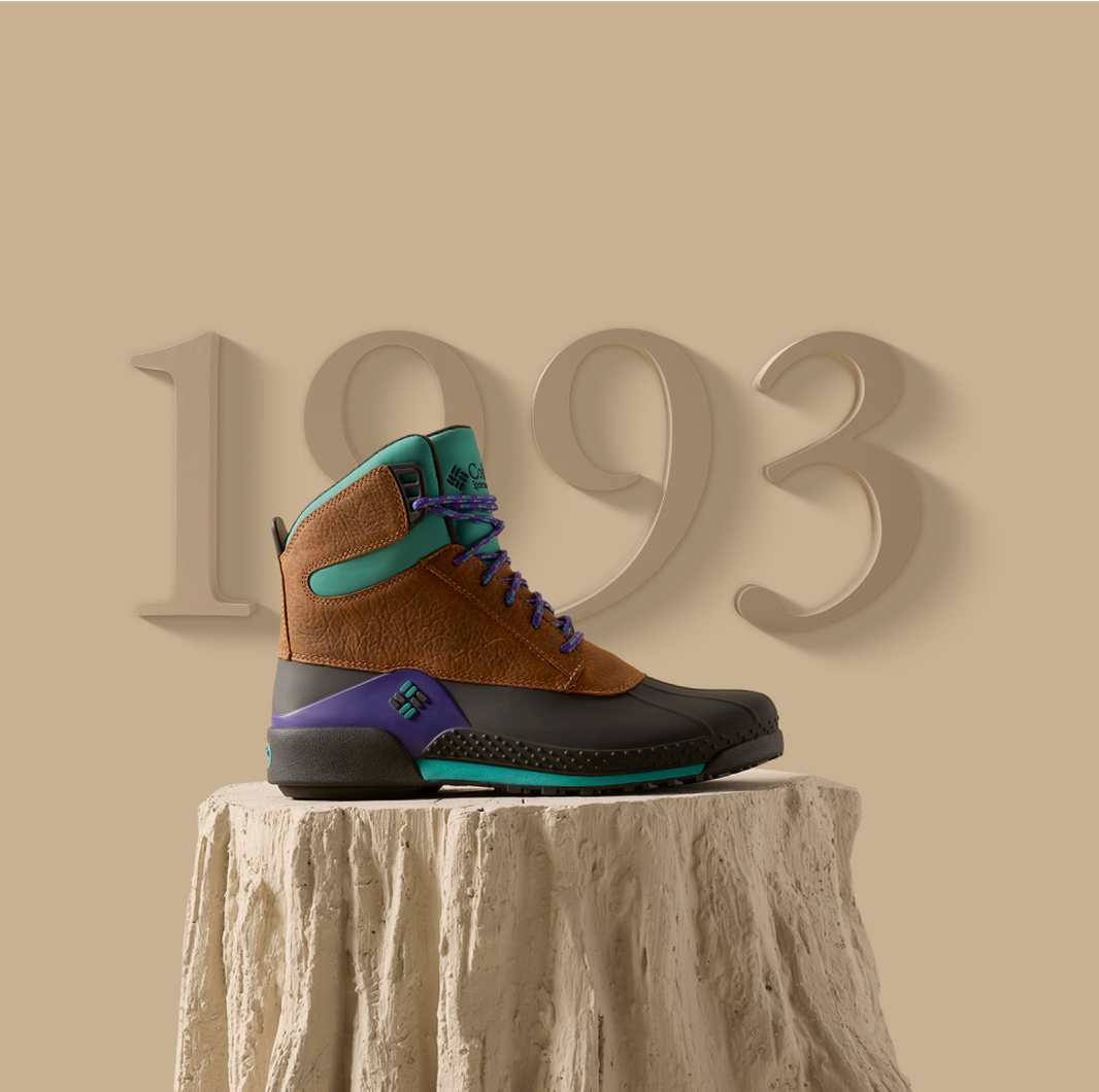 Boot posed on a stylized log display.