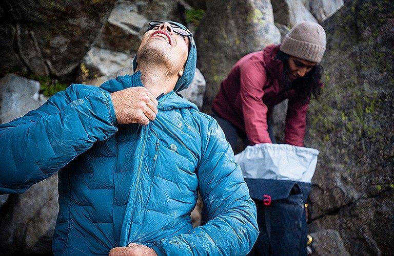 Climber stretching in the Super/DS Jacket 