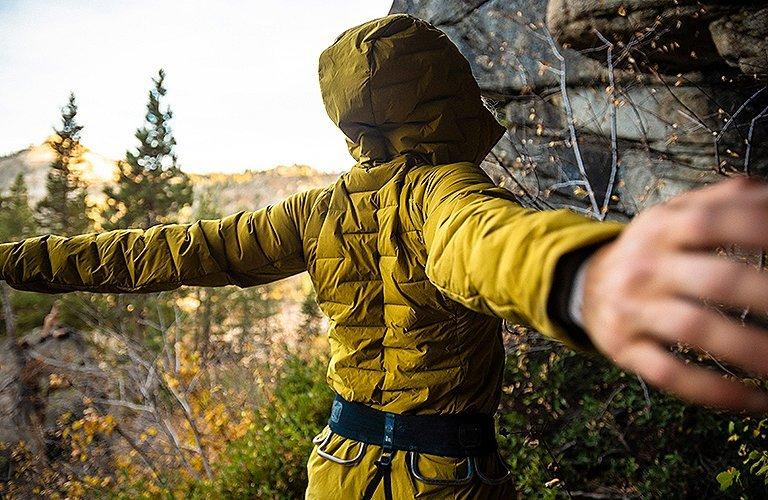 Climber stretching in the Super/DS Jacket 
