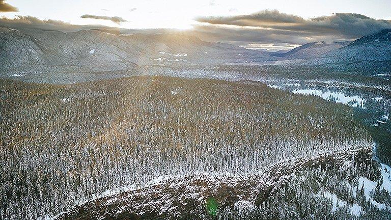 Aerial view of a mountain landscape covered in snow