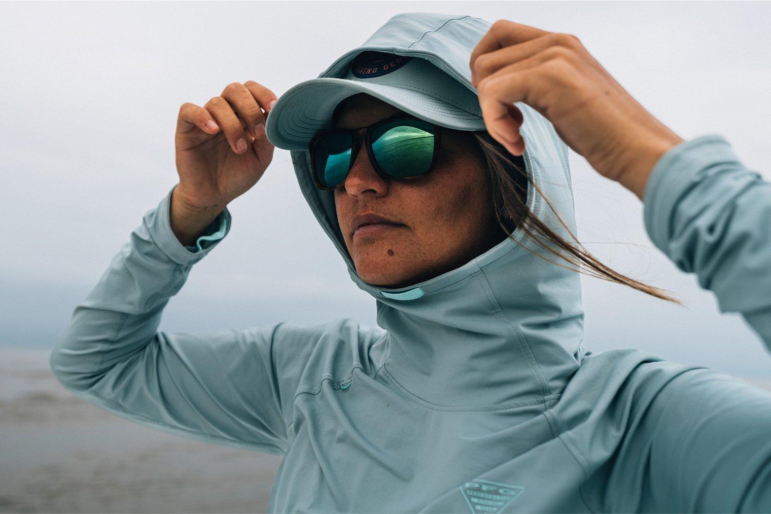 Angler putting on her hood.