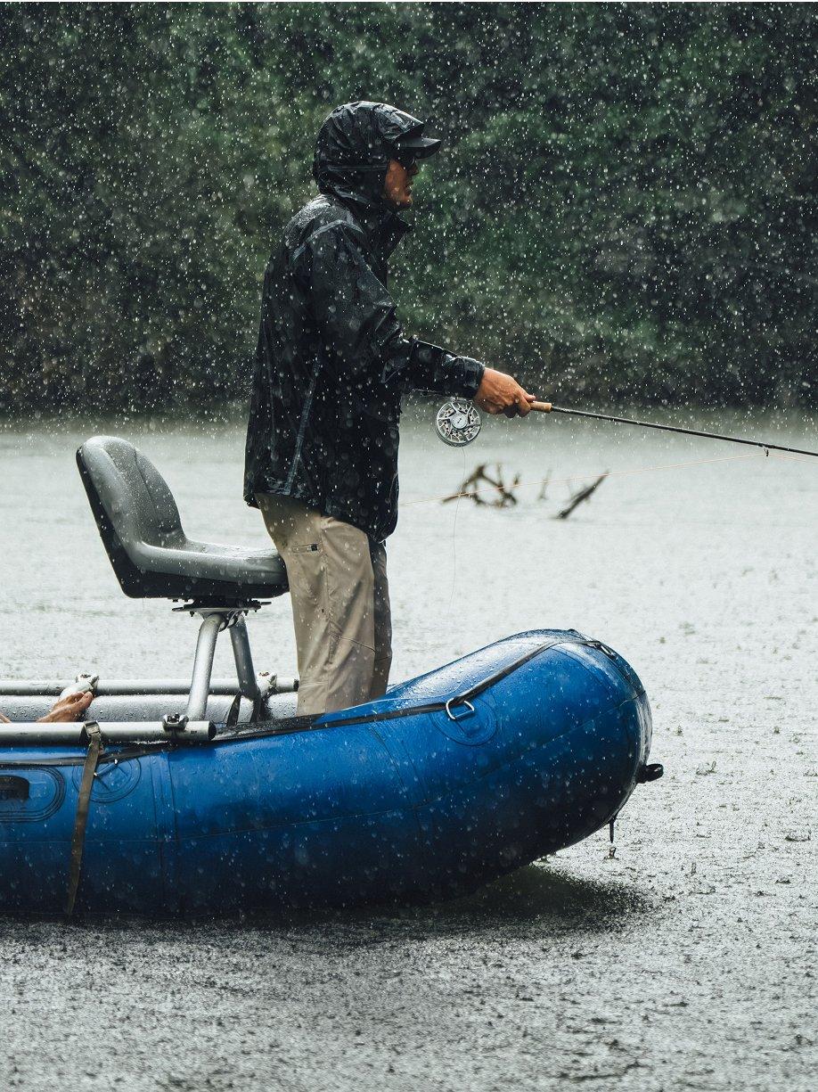 Angler in a rain storm, fishing away.