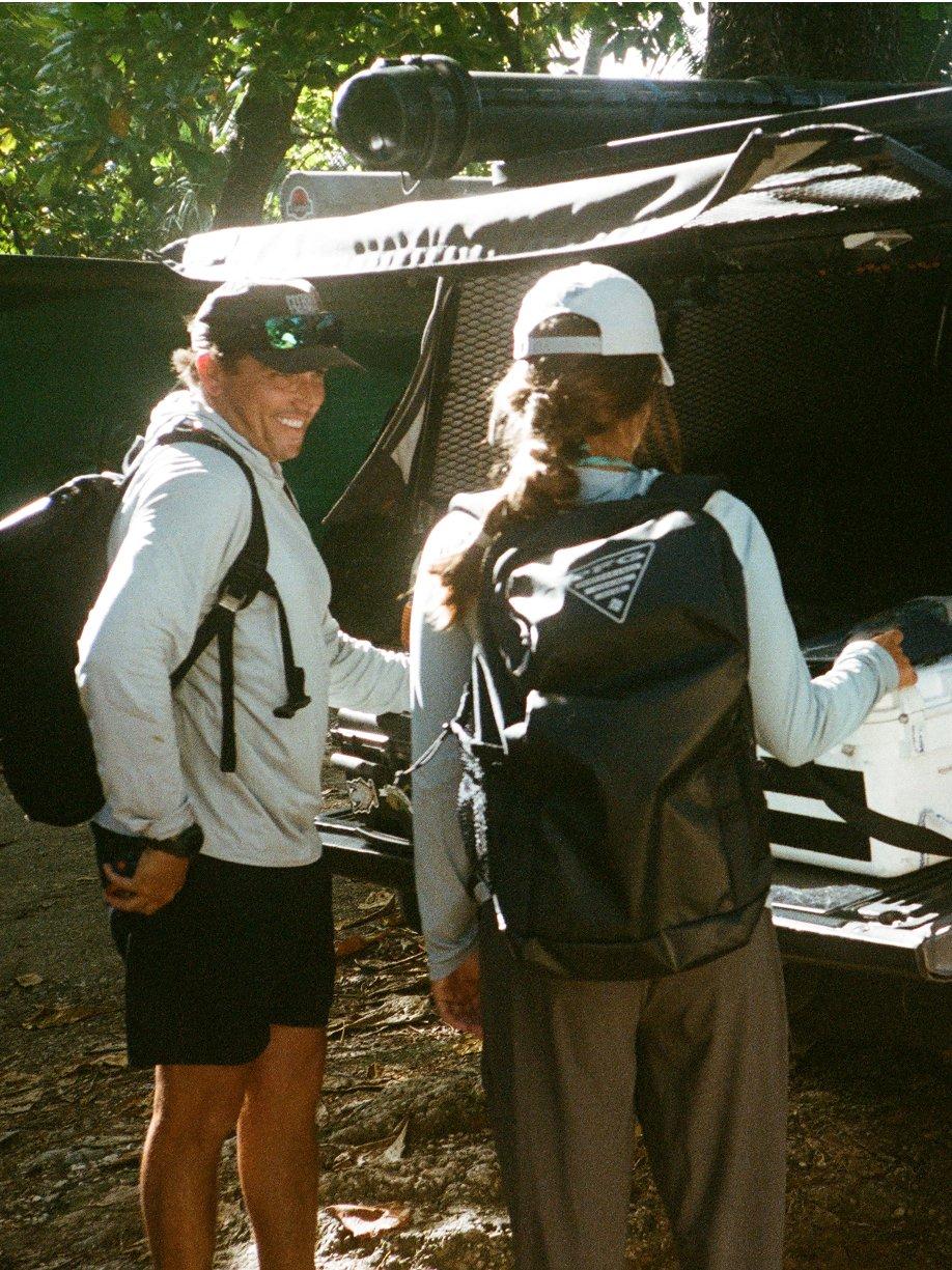 Anglers packing up a truck.