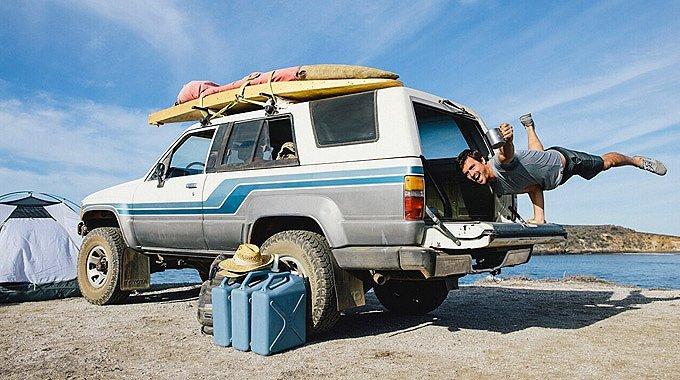 prAna Ambassador Nole Cossart strikes an impromptu yoga pose on a tailgate.