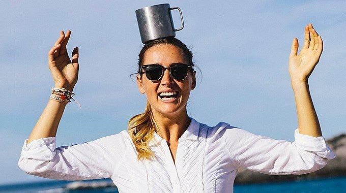 prAna Ambassador Anna Ehrgott balances a metal coffee mug on her head.