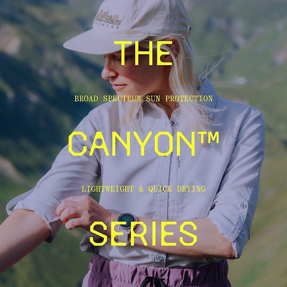 "The Canyon™ Series: Broad Spectrum Sun Protection, lightweight & quick drying" type overlaid on an hiker rolling up the sleeve of the Canyon long sleeve.