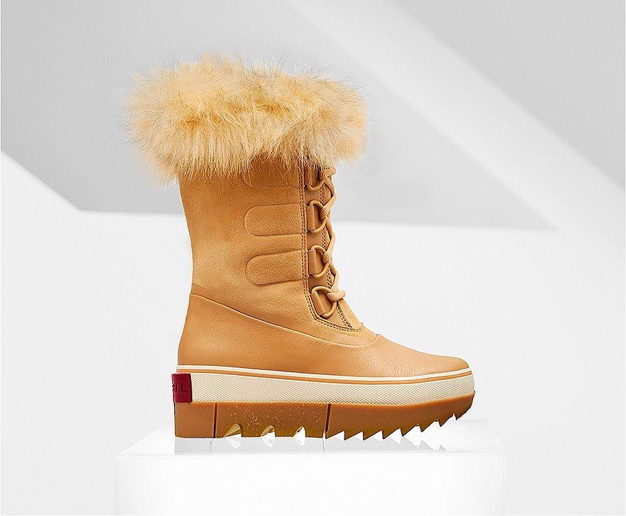 A profile view of the Curry Joan NEXT boot on white background
