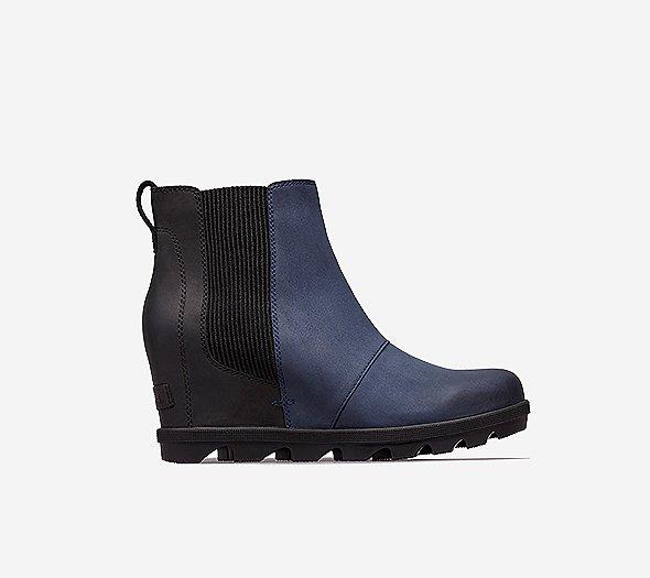 Profile view of a collegiate navy Joan Wedge Chelsea boot